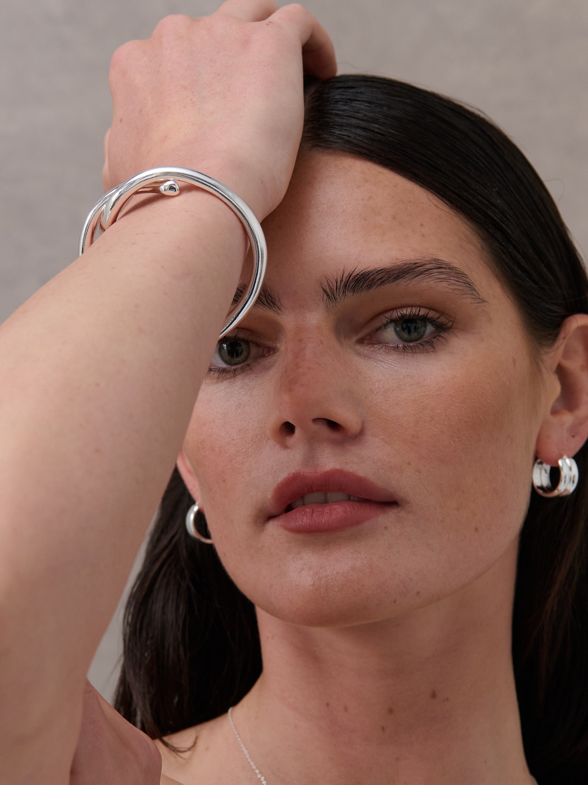 Interlock Twist Sterling Silver Plated Bangle