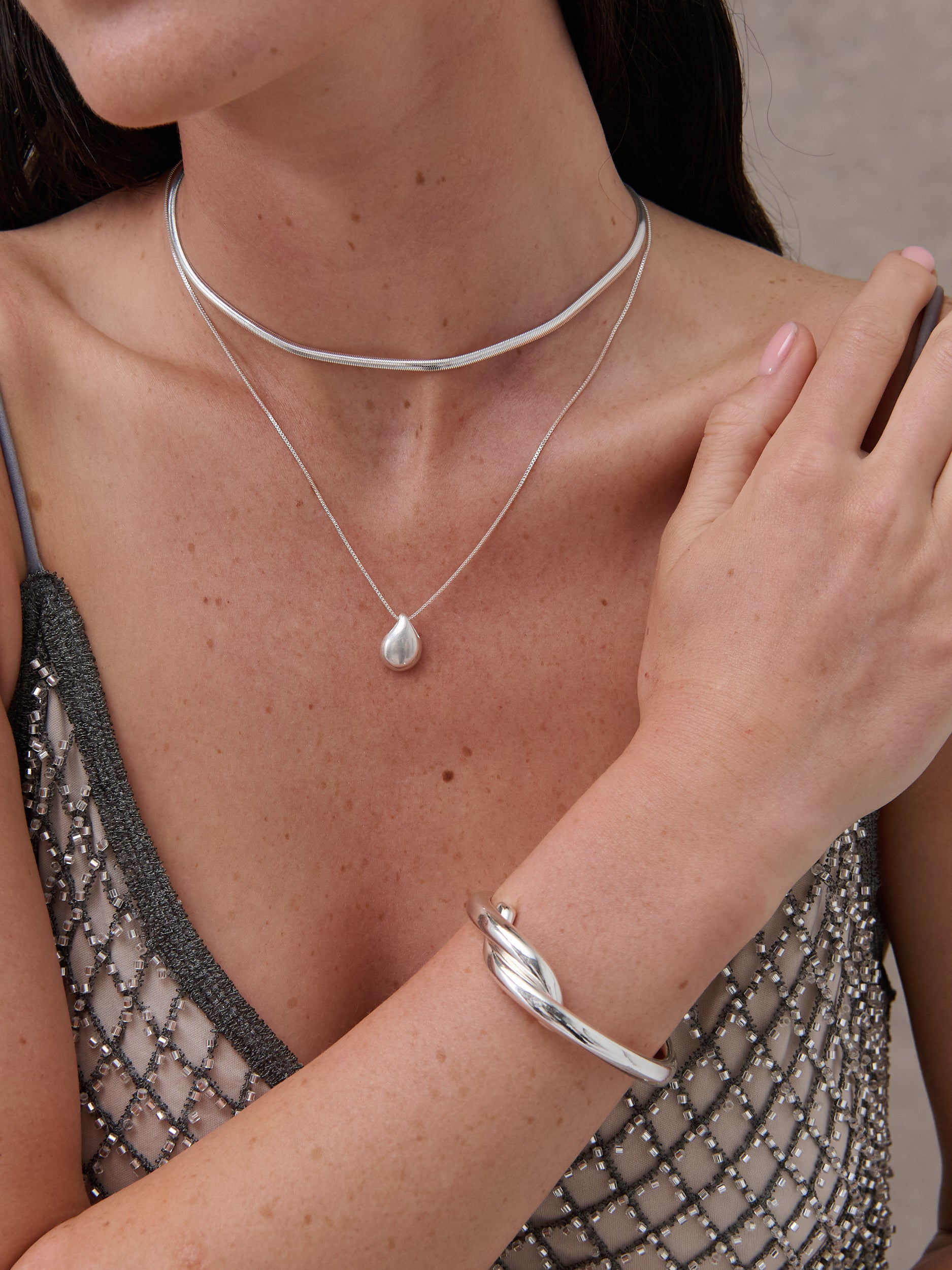 Interlock Twist Sterling Silver Plated Bangle