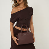 Clemence Pebbled Handbag in Brown
