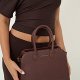 Clemence Pebbled Handbag in Brown