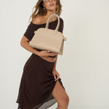 Clemence Pebbled Handbag in Stone