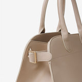 Clemence Pebbled Handbag in Stone