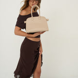 Clemence Pebbled Handbag in Stone